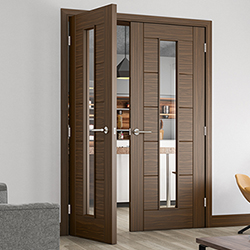 Deanta Seville Internal Fire Door with 7 Panel and 1 Clear Glazed Light - Prefinished Walnut
